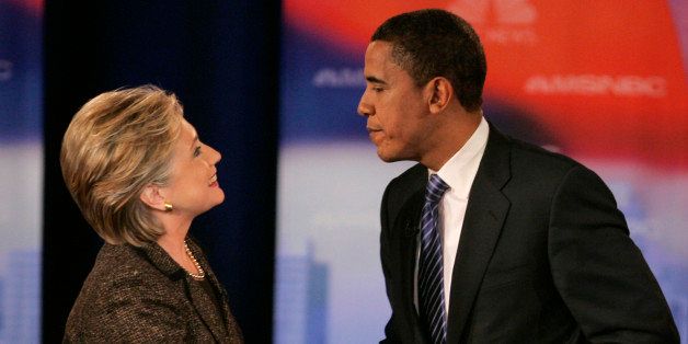 ** FILE ** Democratic presidential hopefuls Sen. Hillary Rodham Clinton, D-N.Y., left, and Sen. Barack Obama, D-Ill., shake hands after a Democratic presidential debate in this Tuesday, Feb. 26, 2008 file photo, in Cleveland. A reader-submitted a question about Clinton and Obama's middle names is being answered as part of an Associated Press Q&A column called "Ask AP." (AP Photo/Mark Duncan)