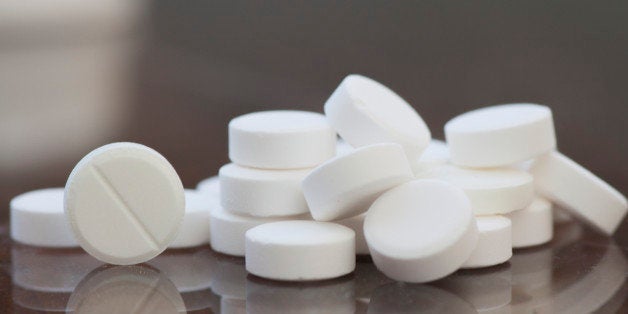 pills on the glass table, day sunlight and reflector