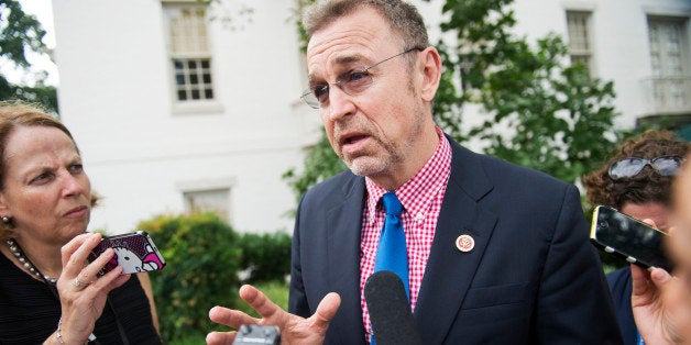 UNITED STATES - JULY 15: Rep. Matt Salmon, R-Ariz., talks with reporters outside of the RNC after a meeting of House republicans, July 15, 2014. (Photo By Tom Williams/CQ Roll Call)