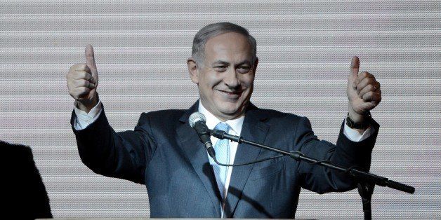 TEL AVIV, ISRAEL - MARCH 18: Israeli Prime Minister and the leader of the Likud Party Benjamin Netanyahu greets supporters at the party's election headquarters after the first results of the Israeli general election on March 18, 2015 in Tel Aviv, Israel. (Photo by Salih Zeki Fazlioglu/Anadolu Agency/Getty Images)
