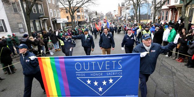 U.S. Rep. Seth Moulton, D-Mass., center without hat, marches with members of OutVets, a group of gay military veterans, during the St. Patrick's Day parade, Sunday, March 15, 2015, in Boston's South Boston neighborhood. Until now, gay rights groups have been barred by the South Boston Allied War Veterans Council from marching in the parade, which draws as many as a million spectators each year. (AP Photo/Steven Senne)