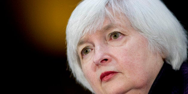 Janet Yellen, chair of the U.S. Federal Reserve, listens during a Senate Banking Committee hearing in Washington, D.C., U.S., on Tuesday, Feb. 24, 2015. Yellen said inflation and wage growth remain too low even as the job market improves, and she signaled that a change in the Fed's guidance on interest rates won't lock it into a timetable for tightening. Photographer: Andrew Harrer/Bloomberg via Getty Images 