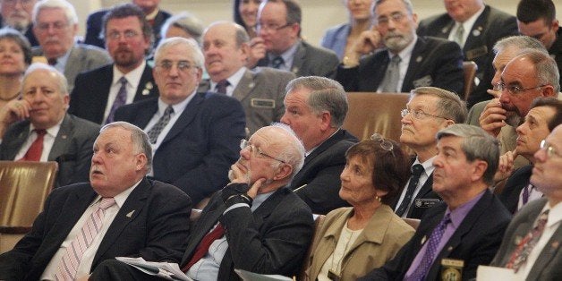 House members watch for the vote totals in a vote to reconsider a bill killed last week to allow casino gambling, Wednesday, May 7, 2014 in Concord, N.H. The House voted 192-172 not to reconsider.(AP Photo/Jim Cole)