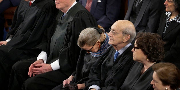 In this photo taken Jan. 20, 2015 members of the Supreme Court, including Justice Ruth Bader Ginsburg, center, rests during President Barack Obama's State of the Union address on Capitol Hill in Washington. Ginsburg has a confession: She "wasn't 100 percent sober" when she fell asleep at the president's State of the Union address last month. Ginsburg told an audience Thursday that she drank some wine at dinner before attending the speech, where cameras repeatedly caught her nodding off. The 81-year-old justice says she had dined with Justice Anthony Kennedy and couldn't resist the California wine he brought. (AP Photo/Pablo Martinez Monsivais)