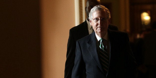 WASHINGTON, DC - MARCH 17: Senate Majority Leader Mitch McConnell (R-KY) returns to his office following a press conference at the U.S. Capitol March 17, 2015 in Washington, DC. McConnell answered questions on the stalled Senate vote on Attorney General nominee Loretta Lynch during the press conference that followed the weekly Republican policy luncheon. (Photo by Win McNamee/Getty Images)