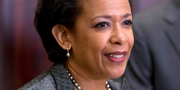 US Attorney Loretta Lynch pauses as she speaks in the Roosevelt Room of the White House in Washington, Saturday, Nov. 8, 2014