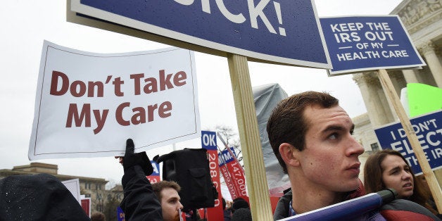 WASHINGTON, DC - MARCH 04: Ryan Burrows, right, protests with others that are not in support of the portions of the Affordable Care Act on which the Supreme Court of the United States was hearing arguments on Wednesday March 04, 2015 in Washington, DC. (Photo by Matt McClain/ The Washington Post via Getty Images)