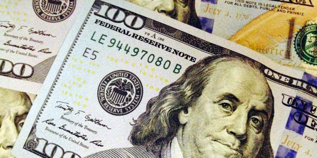 This Feb. 2, 2015, photo depicts a part of a U.S. $100 bill. Who gets what share of the federal budget pie has shifted over t