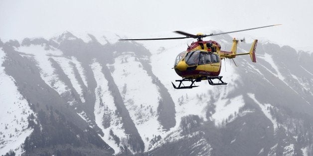 A helicopter participates in rescue efforts on March 24, 2015 in the southeastern French town of Seyne after a German Airbus
