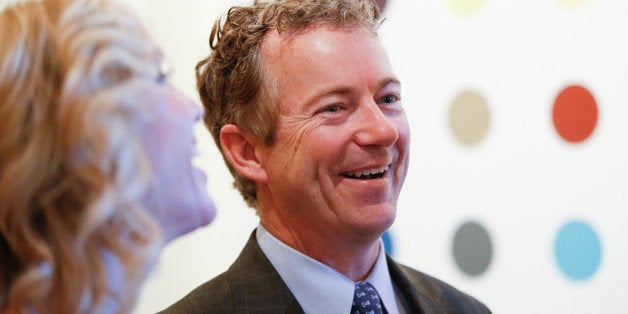 Sen. Rand Paul (R-Ky.) laughs with his wife Kelley Ashby, left, as they arrive at a private reception for Britainâs Prince Charles at the British Ambassador's Residence on Wednesday, March 18, 2015 in Washington. (AP Photo/Andrew Harnik)