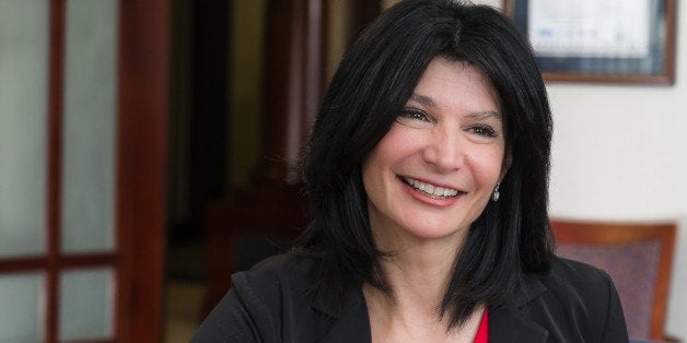 In this photo taken Sept. 19, 2014, National Education Association (NEA) President Lily Eskelsen Garcia answers questions during an interview with The Associated Press in her office at NEA headquarters in Washington. Garcia is a Spanish speaking, guitar playing author and a former Utah teacher of the year who doesn't shy from criticizing what she describes as "toxic" testing. (AP Photo/J. David Ake)