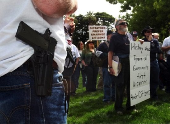 Guns 'Not Unusual In Political Rallies'