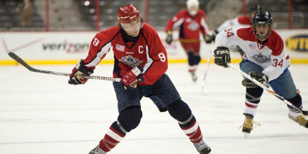 UNITED STATES MARCH 4: Team Lawmakers captainTim Reagan takes a shot during the 4th Annual Congressional Hockey Challenge a