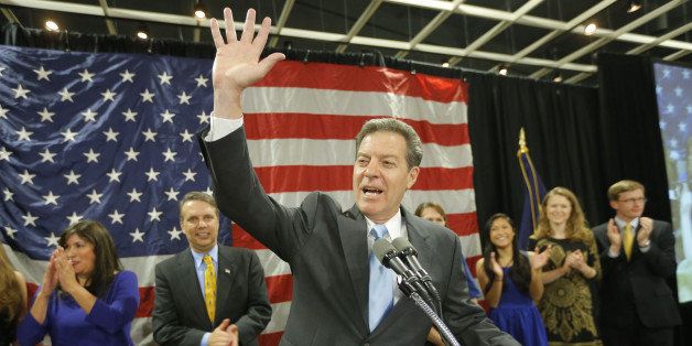 Kansas Gov. Sam Brownback waves to a cheering crowd in Topeka , Kan., on Tuesday, Nov. 4, 2014, after he was re-elected. (Travis Heying/Wichita Eagle/MCT via Getty Images)