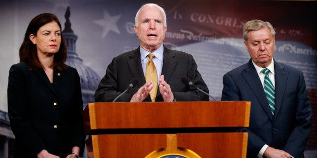 Senate Armed Service Committee Chairman Sen. John McCain, R-Ariz., center, accompanied by fellow committee members, Sen. Kell