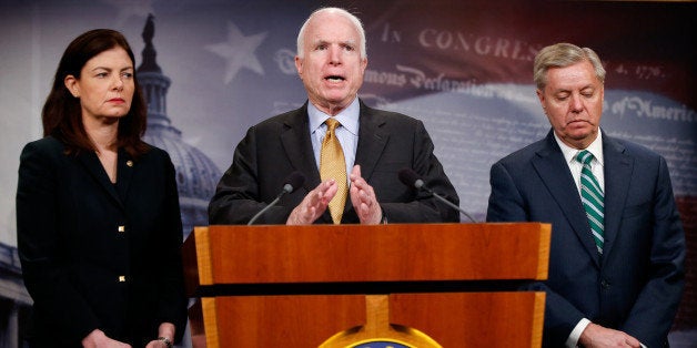 Senate Armed Service Committee Chairman Sen. John McCain, R-Ariz., center, accompanied by fellow committee members, Sen. Kelly Ayotte, R-N.H., left, and Sen. Lindsey Graham, R-S.C., speaks during a news conference on Capitol Hill in Washington, Thursday, March 26, 2015, to talk about the situation in Yemen. (AP Photo/Andrew Harnik)