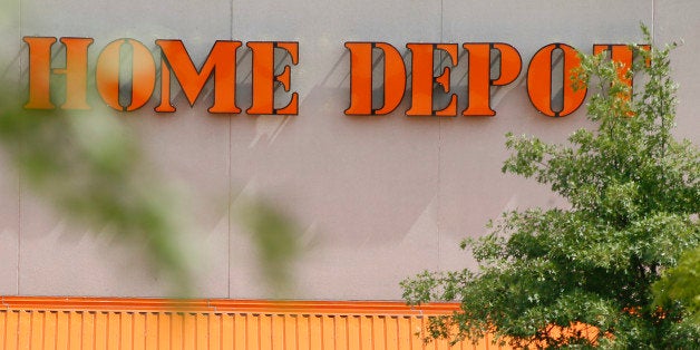 Customers push carts of goods from the Home Depot store in Cranberry, Pa., Butler County, on Wednesday, Sept. 10, 2014. Share