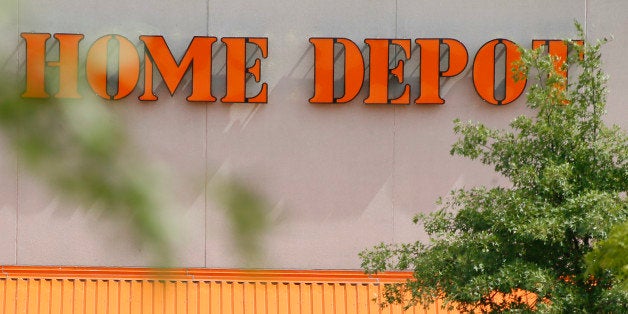 Customers push carts of goods from the Home Depot store in Cranberry, Pa., Butler County, on Wednesday, Sept. 10, 2014. Shares of Home Depot are under pressure Wednesday as the home improvement retailer contends with the fallout of a data breach at its more than 2,000 U.S. and Canadian stores. (AP Photo/Keith Srakocic)