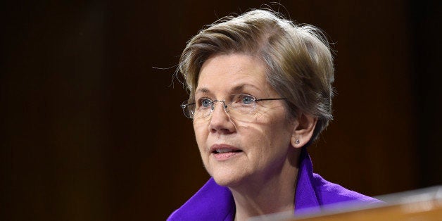 Senate Banking Committee member Sen. Elizabeth Warren, D-Mass. listens to testimony on Capitol Hill in Washington, Tuesday, Feb. 24, 2015, from Federal Reserve Board Chair Janet Yellen. Yellen said Tuesday that the U.S. economy is making steady progress, but the Fed remains patient in raising interest rates because too many Americans are still unemployed, wage growth remains sluggish and inflation is too low. (AP Photo/Susan Walsh)