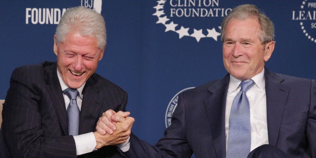 WASHINGTON, DC - SEPTEMBER 08: Former U.S. presidents Bill Clinton (L) and George W. Bush talk about their hopes for the Presidential Leadership Scholars program at the Newseum September 8, 2014 in Washington, DC.With the cooperation of the Clinton, Bush, Lyndon B. Johnson and George H. W. Bush presidential libraries and foundations, the new scholarship program will provide 'motivated leaders across all sectors an opportunity to study presidential leadership and decision making and learn from key administration officials, practitioners and leading academics.' (Photo by Chip Somodevilla/Getty Images)