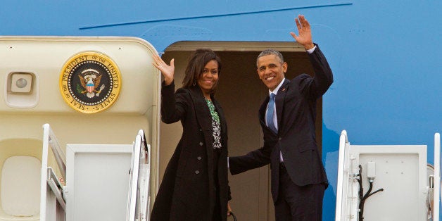 President Barack Obama and first lady Michelle Obama wave from Air Force One before departure at Andrews Air Force Base, Md., Monday, March 30, 2015, en route to Boston to speak at the dedication of Edward M. Kennedy Institute for the United States Senate. (AP Photo/Jose Luis Magana)