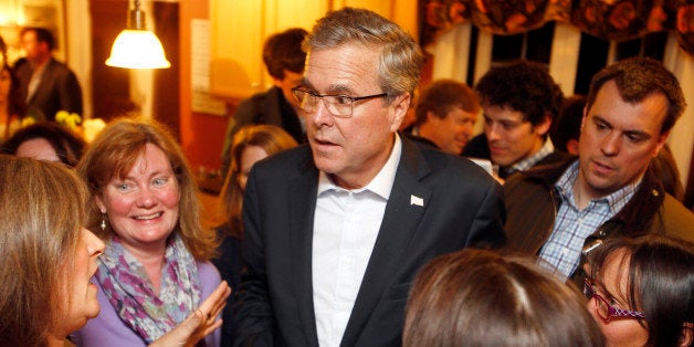 FILE - In this March 13, 2015 file photo, former Florida Gov. Jeb Bush speaks with area residents at a packed house party in