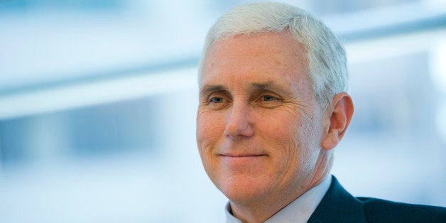 Michael 'Mike' Pence, governor of Indiana, smiles during an interview in New York, U.S., on Thursday, May 16, 2013. The largest-ever U.S. municipal junk bond sale remains in limbo after Indiana learned that a Pakistani company backing a fertilizer plant financed by the biggest borrowing in state history is linked to explosives causing the most U.S. casualties in Afghanistan. Photographer: Andrew Harrer/Bloomberg via Getty Images 