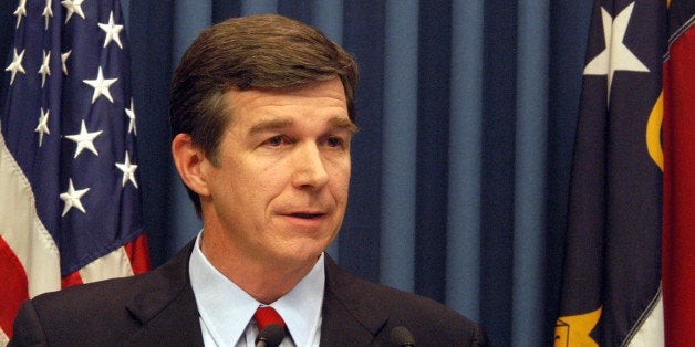 North Carolina Attorney General Roy Cooper answers questions, Saturday Jan. 13, 2007, in Raleigh, N.C. after he announced that his office agreed to take over the sexual assault case against three Duke University lacrosse players at the request of District Attorney Mike Nifong. (AP Photo/Karen Tam)