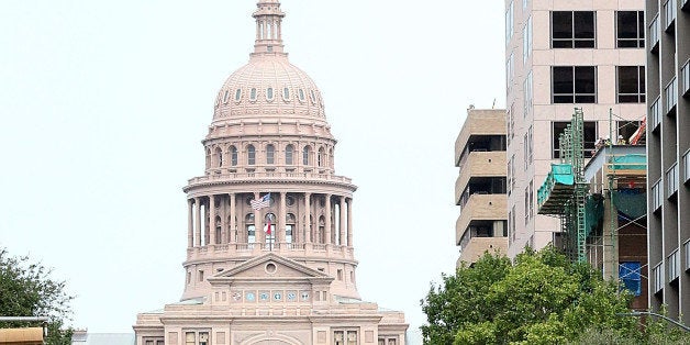 AUSTIN, TX - OCTOBER 29: Sebastian Vettel drives his Formula 1 race car in front of the State Capital during the Zero To Infiniti event on October 29, 2014 in Austin, Texas. (Photo by Gary Miller/Getty Images)