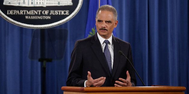 WASHINGTON, DC - MARCH 04: Attorney General Eric Holder delivers remarks about the Justice Department's findings related to two investigations in Ferguson, Missouri, at the Robert F. Kennedy Department of Justice Building March 4, 2015 in Washington, DC. Holder delivered the remarks for an audience of department employees who worked on the investigations after a white police officer shot and killed an unarmed black teenager, sparking weeks of demonstrations and violent clashes. (Photo by Chip Somodevilla/Getty Images)