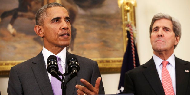 Secretary of State John Kerry listens at right as President Barack Obama speaks about the Islamic State group, Wednesday, Feb. 11, 2015, in the Roosevelt Room of the White House in Washington. Obama asked the U.S. Congress on Wednesday to authorize military force to "degrade and defeat" Islamic State forces in the Middle East without sustained, large-scale U.S. ground combat operations, setting lawmakers on a path toward their first war powers vote in 13 years. (AP Photo/Jacquelyn Martin)