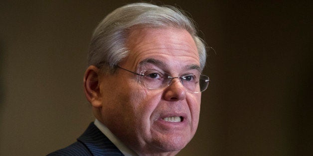 Sen. Bob Menendez, D-N.J., speaks to reporters during a news conference in Newark, N.J. on Friday, March 6, 2015. A person fa