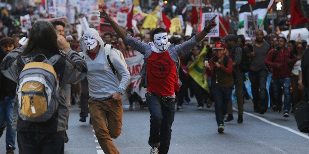 NEW YORK, NY - MAY 01: People run down Broadway in Manhattan on International Workers Day, or Labor Day, on May 1, 2013 in N