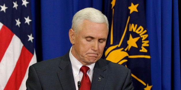 Indiana Gov. Mike Pence listens to a question during a news conference Tuesday, March 31, 2015, in Indianapolis. Pence said that he wants legislation on his desk by the end of the week to clarify that a new religious-freedom law does not allow discrimination. The law has triggered an outcry, with businesses and organizations voicing concern and some states barring government-funded travel to the Midwestern state. (AP Photo/Darron Cummings)