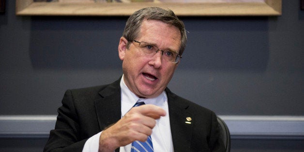 UNITED STATES - NOVEMBER 13: Sen. Mark Kirk, R-Ill., speaks with Roll Call at his desk in the Hart Senate Office Building on