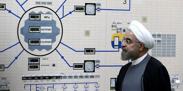 In this photo released by the Iranian Presidency Office, President Hassan Rouhani visits the Bushehr nuclear power plant just outside the port city of Bushehr, southern Iran, Tuesday, Jan. 13, 2015. (AP Photo/Iranian Presidency Office, Mohammad Berno)