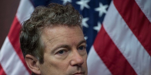 US Republican Senator from Kentucky Rand Paul attends a press conference to announce new bipartisan legislation to allow patients, doctors and businesses in states that have already passed medical marijuana laws to participate in those programs without fear of federal prosecution.on Capitol Hill in Washington, DC, on March 10, 2015. AFP PHOTO/NICHOLAS KAMM (Photo credit should read NICHOLAS KAMM/AFP/Getty Images)