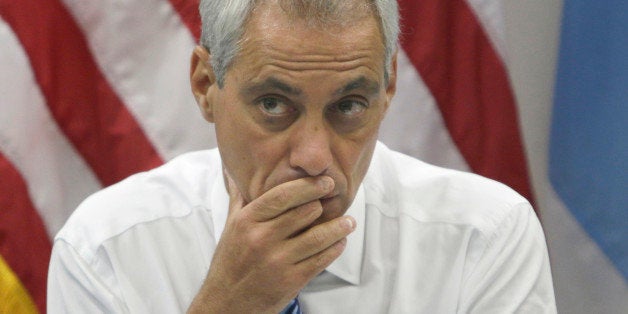 Chicago Mayor Rahm Emanuel looks at the crowd before a news conference Monday, July 21, 2014, in Chicago. Emanuel met with law enforcement and school officials to talk about the city's violence problem. The mayor says the solutions to the city's violence problems are complicated and involve more job opportunities, education and getting guns off city streets. (AP Photo/Stacy Thacker)