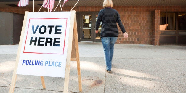 Subject: A voter approaching an election polling place station during a United States election.