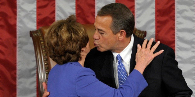 House Minority Leader Nancy Pelosi of Calif. gets a kiss from House Speaker John Boehner of Ohio after he was re-elected as House Speaker as the 113th Congress began, Thursday, Jan. 3, 2013, on Capitol Hill in Washington. (AP Photo/Susan Walsh)