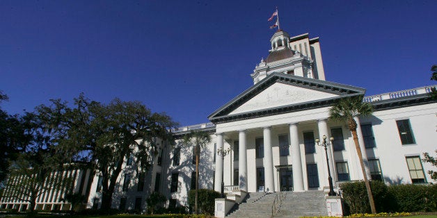 Flowers bloom near the Florida Capitol buildings Monday, March 4, 2013, in Tallahassee, Fla. The Florida Legislature convenes its 60-day session Tuesday. (AP Photo/Phil Sears)