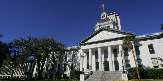 Flowers bloom near the Florida Capitol buildings Monday, March 4, 2013, in Tallahassee, Fla. The Florida Legislature convenes its 60-day session Tuesday. (AP Photo/Phil Sears)