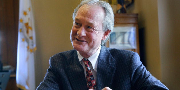 In this Thursday, Dec. 11, 2014 photo Rhode Island Gov. Lincoln Chafee responds to questions during an interview with The Ass