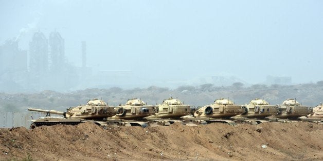 Saudi army tanks are seen deployed near the Saudi-Yemeni border, in southwestern Saudi Arabia, on April 9, 2015. The Saudi-le