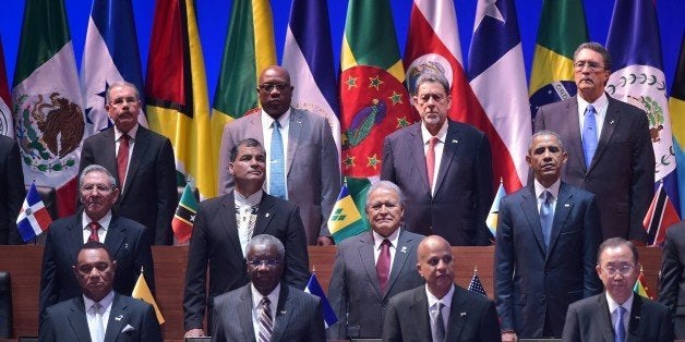 Cuba's President Raul Castro (L, middle row) and US President Barack Obama (R, middle row) are pictured with other leaders during the opening ceremony of the Summit of the Americas at the ATLAPA Convention Center in Panama City on April 10, 2015. AFP PHOTO/MANDEL NGAN (Photo credit should read MANDEL NGAN/AFP/Getty Images)