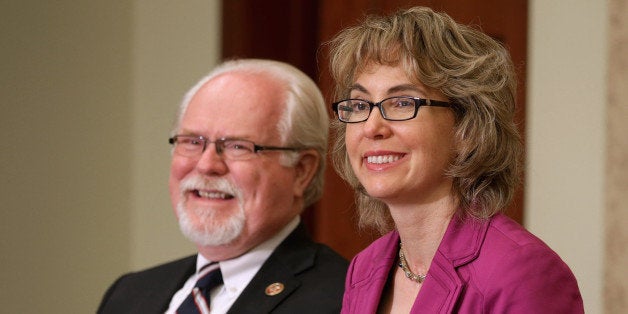 WASHINGTON, DC - APRIL 16: U.S. Rep. Ron Barber (D-AZ) (L) and former U.S. Rep. Gabrielle Giffords (D-AZ) attend the dedicat