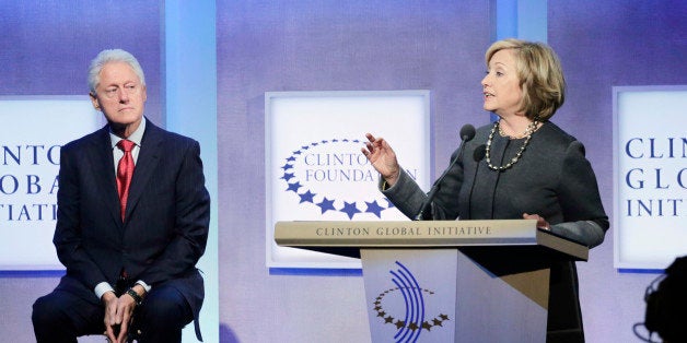 Former President Bill Clinton, left, listens to his wife, former Secretary of State Hillary Rodham Clinton, during a discussion at the Clinton Global Initiative, Monday, Sept. 22, 2014 in New York. (AP Photo/Mark Lennihan)