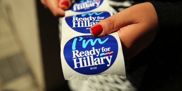 NEW YORK, NY - APRIL 11: Stickers are handed out to supporters of Hillary Rodham Clinton's yet to be announced presidential campaign at a rally in Manhattan on April 11, 2015 in New York City. It is expected that Clinton will end months of speculation and launch her anticipated 2016 presidential campaign on Sunday with an announcement on social media. Following that it is believed that candidate Clinton will travel to Iowa and New Hampshire, seeking to connect directly with voters in more intimate settings. (Photo by Spencer Platt/Getty Images)