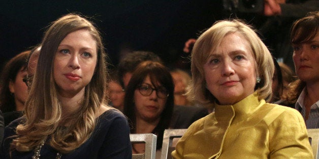 Former U.S. Secretary of State Hillary Clinton, right, and daughter Chelsea Clinton attend the closing plenary session of the Clinton Global Initiative on Wednesday, Sept. 24, 2014 in New York. (Photo by Greg Allen/Invision/AP)