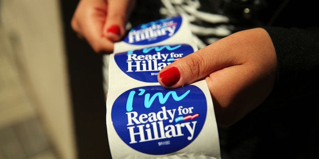 NEW YORK, NY - APRIL 11: Stickers are handed out to supporters of Hillary Rodham Clinton's yet to be announced presidential campaign at a rally in Manhattan on April 11, 2015 in New York City. It is expected that Clinton will end months of speculation and launch her anticipated 2016 presidential campaign on Sunday with an announcement on social media. Following that it is believed that candidate Clinton will travel to Iowa and New Hampshire, seeking to connect directly with voters in more intimate settings. (Photo by Spencer Platt/Getty Images)